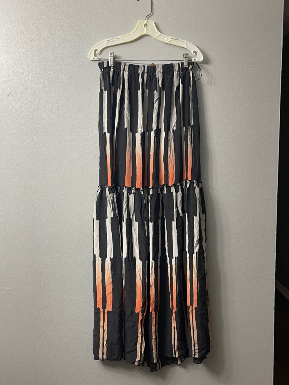 Ali Ro silk Tie Dye Maxi Skirt, featuring a black and orange abstract design 6